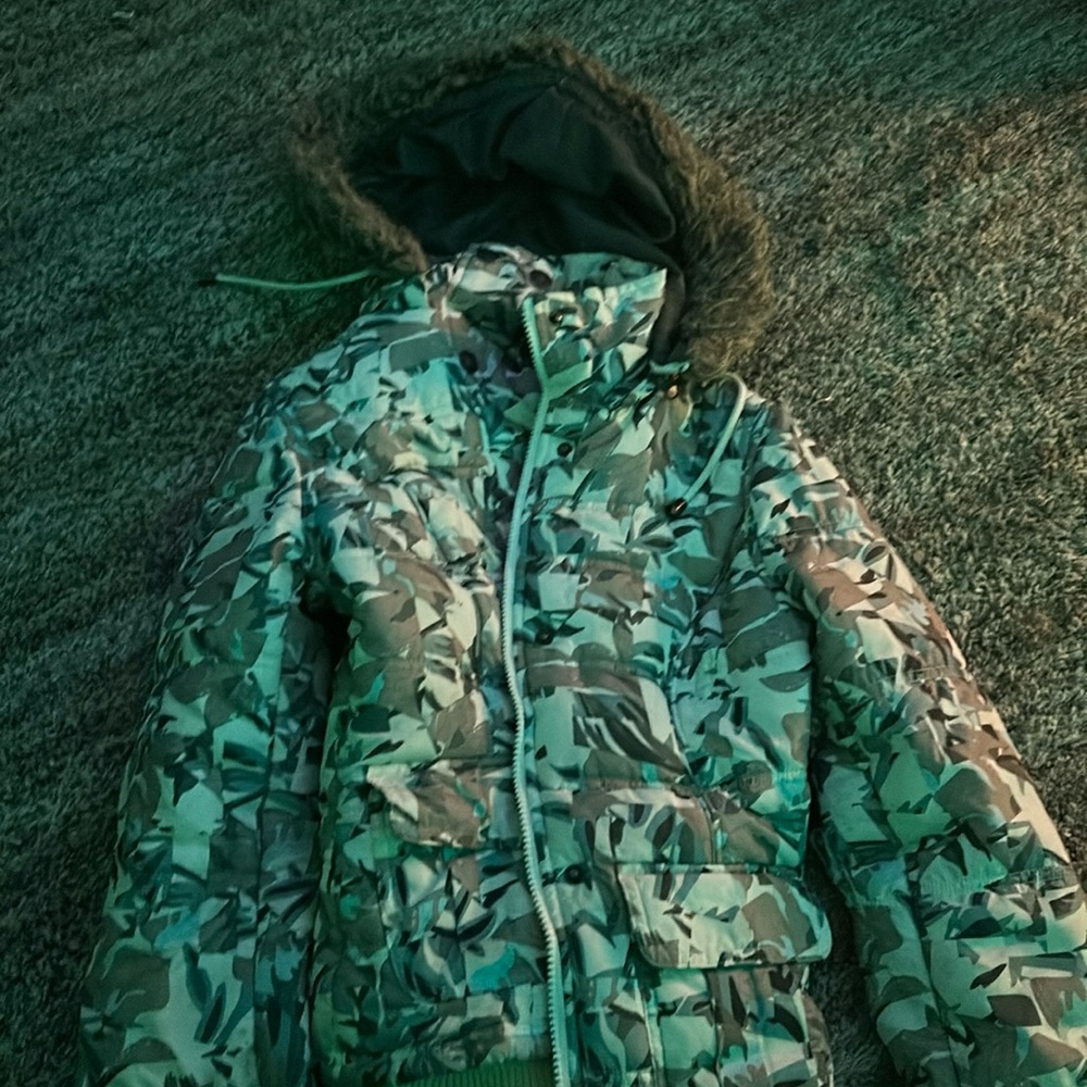 Selling a coat, fuzzy hood very warm, multi colored
